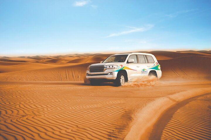 Experience the vast beauty of the Dubai desert while embarking on an unforgettable 4x4 journey where golden dunes meet picturesque sunsets creating lasting memories under the open sky.
